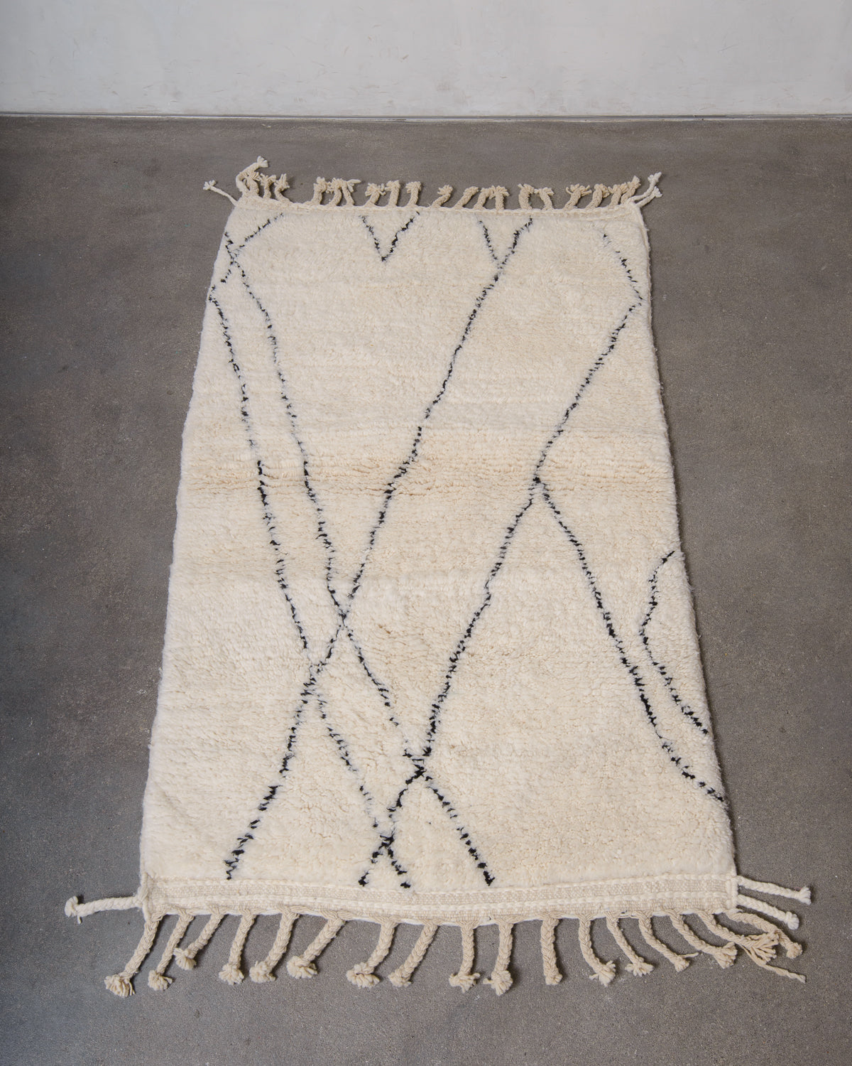 Modern, designer, handcrafted Berber rug from Morocco. Beniourain carpet with minimalist design, natural wool pile and a fluffy texture.
